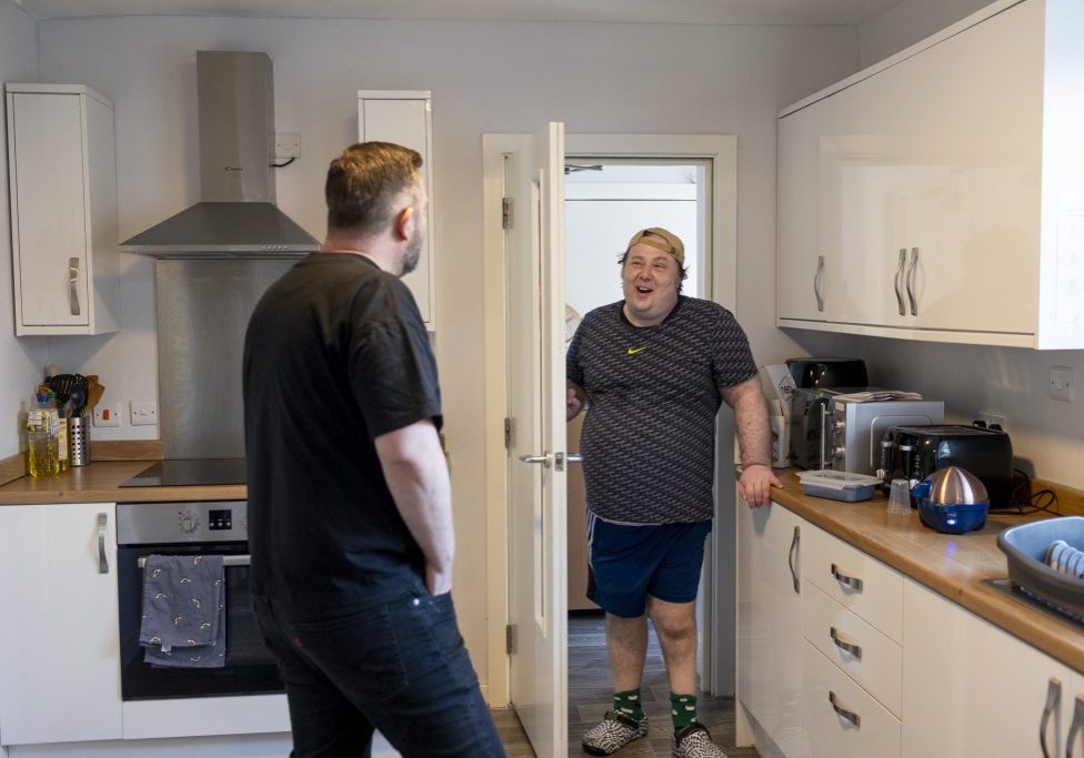 Photo - people talking in the kitchen